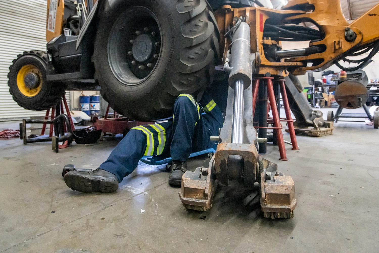 Heavy equipment repair in workshop