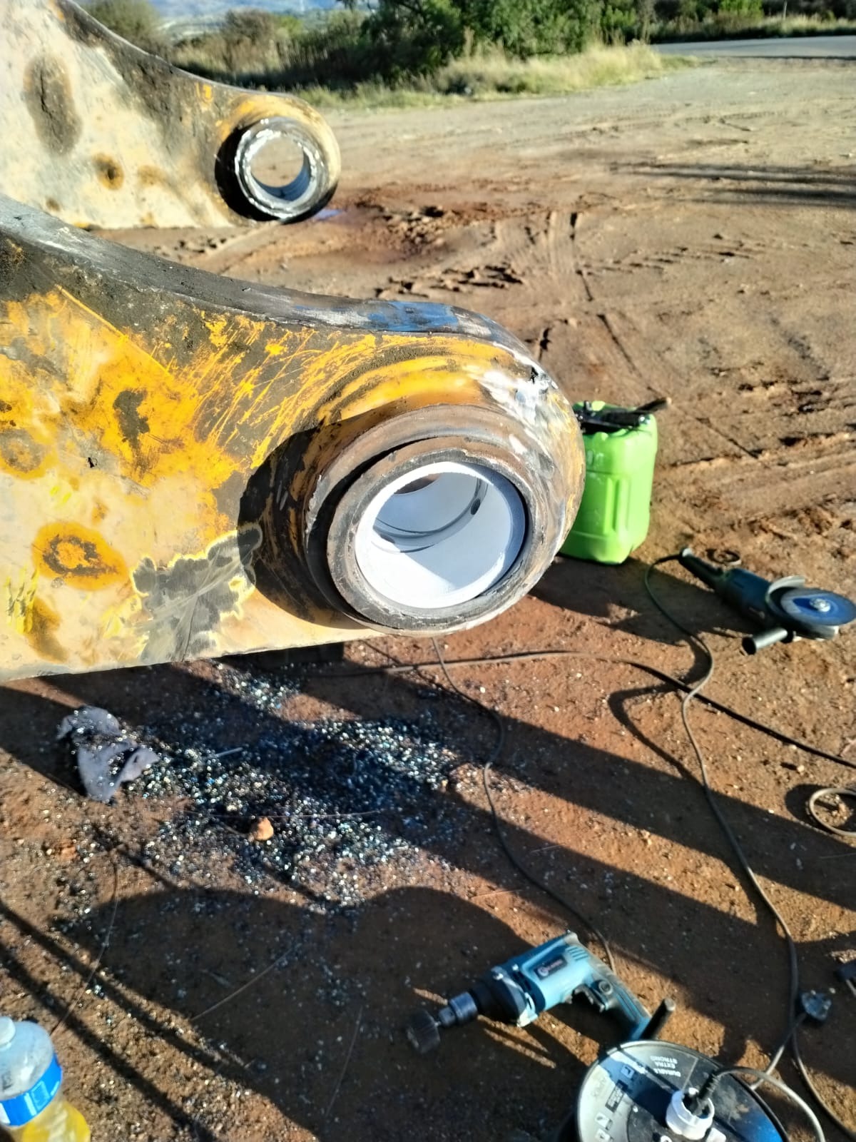 Excavator boom with freshly fitted bush after on-site line boring
